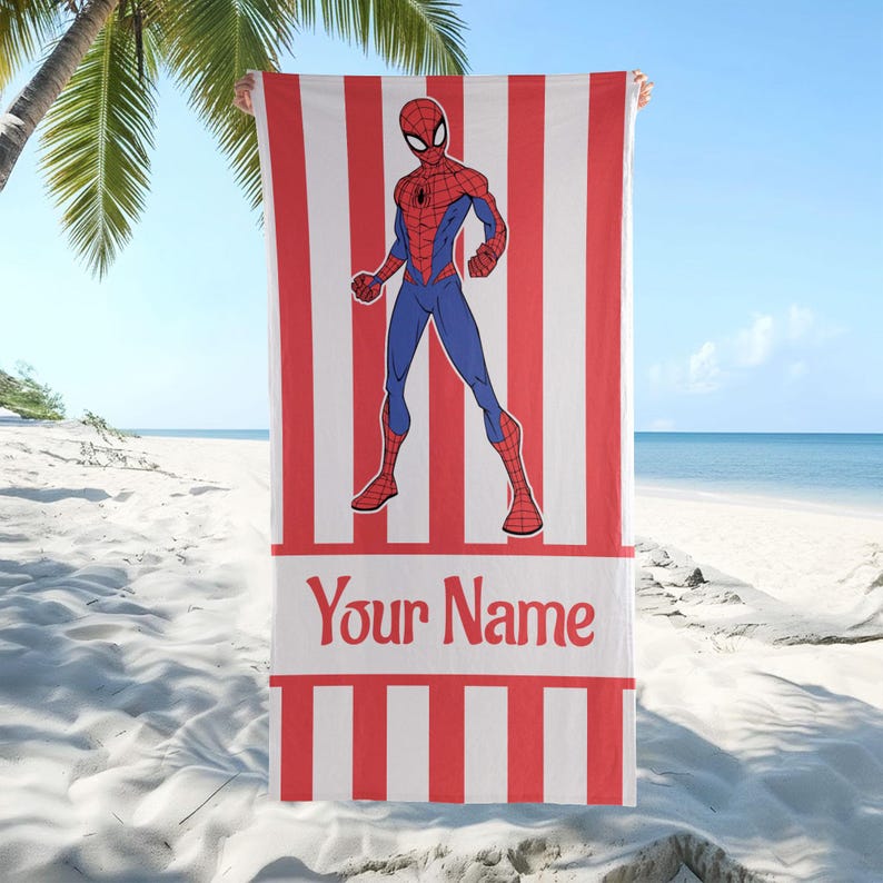 May include: A rectangular beach towel featuring a red and white vertical striped pattern. Centered on the towel is a graphic illustration of the superhero Spider-Man in a standing pose. Below the figure is a white horizontal band with the text Your Name.