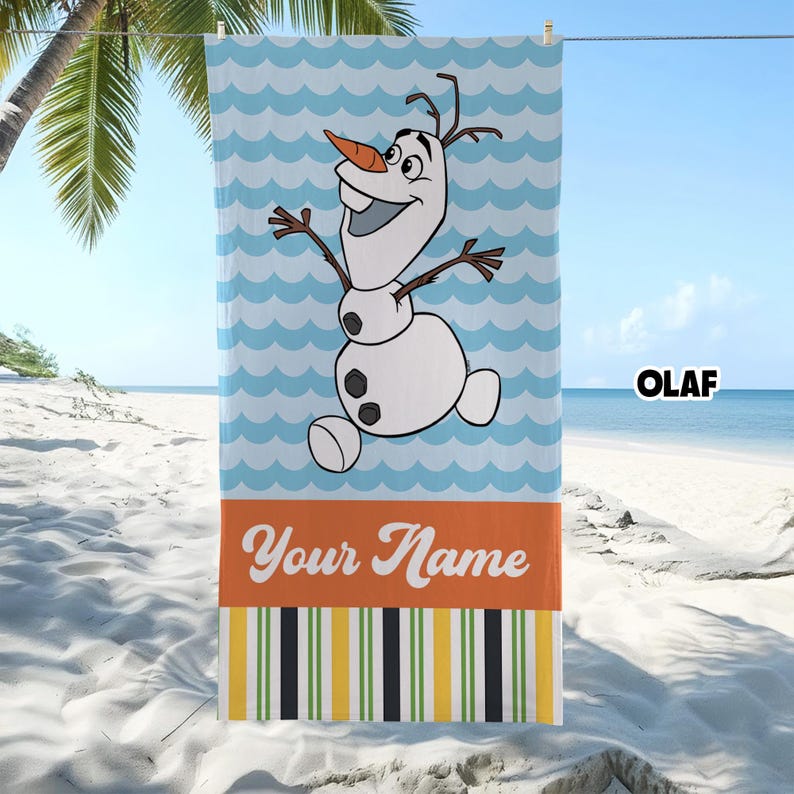 May include: A rectangular beach towel featuring a cartoon snowman with a carrot nose and twig arms centered on a light blue wavy background. Below the character is an orange horizontal band with the text Your Name and a striped pattern.