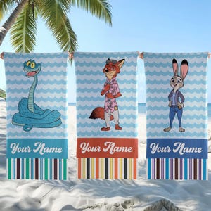 May include: Three rectangular beach towels featuring a light blue and white wavy pattern background. Each towel displays a cartoon character: a blue snake, a fox in a pink shirt, and a rabbit in a blue jacket. Each towel has the text Your Name.