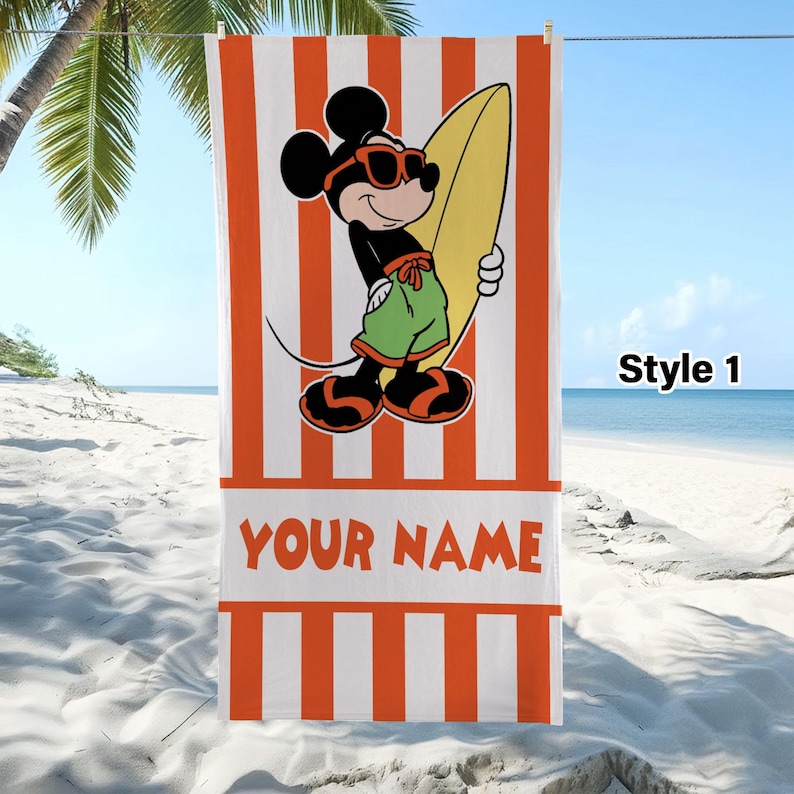 May include: A rectangular beach towel featuring vertical orange and white stripes. The center displays a graphic of Mickey Mouse wearing orange sunglasses, green shorts, and sandals while holding a yellow surfboard. The text YOUR NAME is printed.