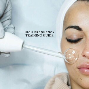 May include: A high-frequency skin treatment device with a clear glass applicator is applied to a person's face. The device is held by a gloved hand. The text "HIGH FREQUENCY TRAINING GUIDE" is visible in the image.