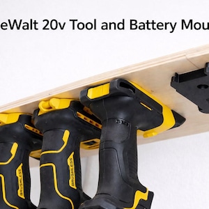 May include: Black and yellow DeWalt 20v tool and battery mounts. The image shows three black and yellow cordless drills hanging from a wooden shelf. The text "DeWalt 20v Tool and Battery Mounts" is at the top of the image.