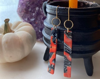 PSYCHEDELIC melting resin orange black and gold long earrings