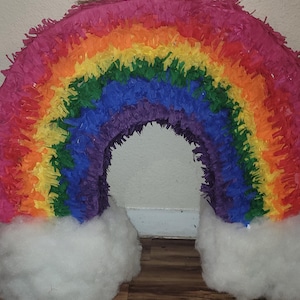 Rainbow piñata w/ clouds on both ends, custom made and bold colors.