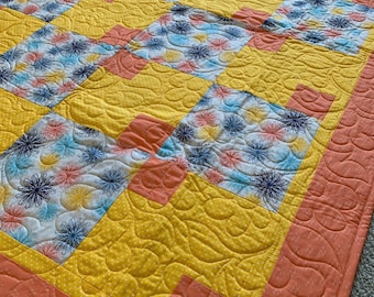 Swirl Blooms- A coral yellow and navy kids quilt- handmade quilt