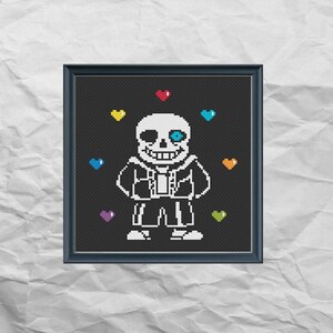 May include: A black and white pixel art cross-stitch pattern of Sans from the video game Undertale. Sans is surrounded by colorful hearts.