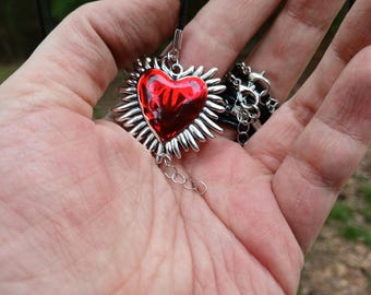 Silvery pendant on waxed leather cord