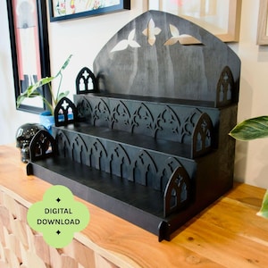 May include: A black wooden shelf unit with six shelves and a gothic arch design. The unit has a decorative top with cut-out shapes. The text "DIGITAL DOWNLOAD" and "CONTAINS SIX SHELVES" are visible. The unit is 50cm wide.