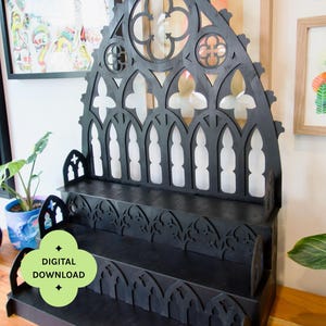 May include: A black tiered display shelf featuring an intricate gothic arch design with pointed windows and circular cutouts. The structure includes multiple levels for storage and display. Text on the image reads: DIGITAL DOWNLOAD, CONTAINS SIX SHELVES, 50CM WIDE, 30CM WIDE, 2/3/4 TIERS.