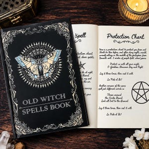 May include: A black book titled Old Witch Spells Book with a butterfly illustration on the cover. The open pages display a Protection Chart, a protection chant, and a pentagram symbol. The text includes instructions for casting spells.