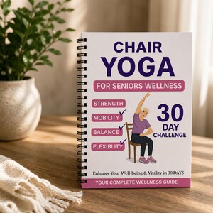 May include: A spiral-bound book titled "CHAIR YOGA" with the subtitle "FOR SENIORS WELLNESS." The cover features an illustration of a person doing yoga in a chair, with text highlighting strength, mobility, balance, and flexibility. The book promises a 30-day challenge.