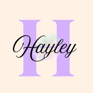 May include: A digital graphic featuring the name "Hayley" in elegant black script over a light purple "H" shape. The background is a soft, neutral beige.