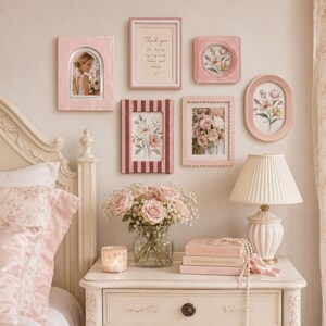 May include: A gallery wall featuring six pink frames of various shapes and sizes, including rectangular, arched, and oval designs. The frames contain floral prints and a text print that reads, Thank you for being by my side today and always.