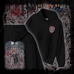 May include: Black hooded sweatshirt with a front pocket. The chest displays a police badge, while the back features a graphic of a person in front of a building, flanked by zombie-like figures. The design has a horror theme.