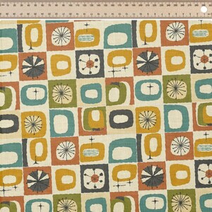 May include: A fabric with a repeating mid-century modern design. The pattern features squares and rectangles in shades of teal, orange, yellow, and grey on a cream background. The design includes stylized shapes and starburst-like elements.