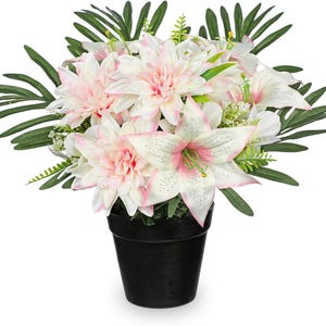 May include: A floral arrangement featuring white and pink dahlias and lilies, accented with green foliage. The flowers are arranged in a black pot, creating a vibrant and natural display. Perfect for home decor or as a gift.