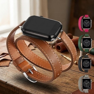 May include: A black smartwatch with a long, tan leather double-wrap band featuring white contrast stitching and a silver metal buckle. The watch face is dark and rectangular. Additional color options for the band are shown in a vertical column.