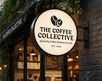 Puede incluir: Un letrero circular e iluminado de tienda con el texto negro THE COFFEE COLLECTIVE, Specialty Coffee Roasters & Cafe y EST. 2018, junto a un logotipo de grano de café con la letra C, montado en una pared de ladrillo negro sobre una entrada.