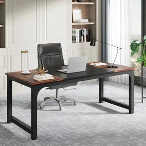 May include: A black and brown desk with a black metal frame. The desk has a laptop, a black leather chair, and a desk lamp. The desk is in an office setting with a white cabinet and a window with a curtain.
