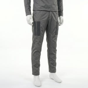 May include: Gray pants with two dark gray rectangular patches on the front of each leg. The pants have a matching gray top and are displayed on a mannequin. The pants have visible stitching.