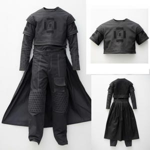 May include: A set of three ceramic mugs with a speckled, matte finish in cream, light grey, and dark grey. Each mug has a simple, minimalist design and a rounded handle.