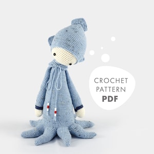 May include: Crochet pattern PDF for a blue octopus amigurumi with a white hooded hat. The octopus has red and blue stripes on its arms.