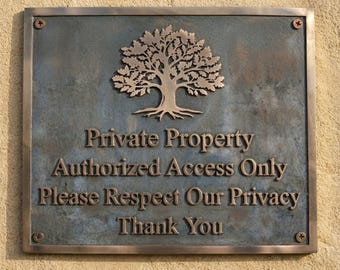 May include: A rectangular bronze-toned metal plaque featuring a raised oak tree emblem at the top. The text reads: Private Property, Authorized Access Only, Please Respect Our Privacy, Thank You. The plaque is secured with four corner screws.