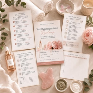 May include: A skincare guide titled Your Hyperpigmentation Roadmap with multiple informational pages, a glass dropper bottle of Radiance Boost Serum, a pink stone gua sha tool, two small bowls with cream, and white rolled towels.