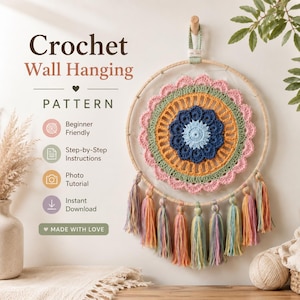 May include: A crochet wall hanging pattern featuring a circular design with concentric rings in light blue, dark blue, orange, green, and pink. The piece is mounted on a wooden hoop with multi-colored yarn tassels hanging from the bottom edge.
