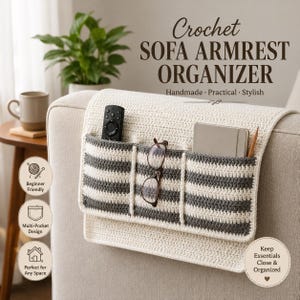 May include: A cream-coloured crochet sofa armrest organiser featuring three pockets with horizontal grey stripes. The organiser holds a black remote control, a pair of spectacles, a grey notebook, and a pencil. Text reads Crochet SOFA ARMREST ORGANISER.