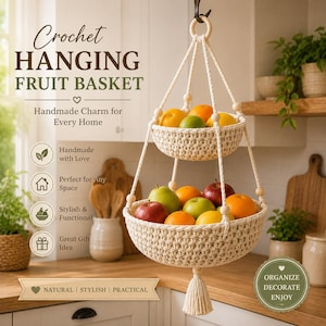 May include: A two-tier hanging fruit basket made of off-white crocheted cord with wooden beads and a bottom tassel. The basket holds various fresh fruits including apples, oranges, and limes. Text on the image reads Crochet HANGING FRUIT BASKET.