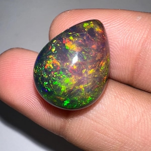 Black Opal Ethiopian Natural Loose Gem Wholesale For Jewellery Making Size (15.40x20) There is a long crack in this opal But it is hidden