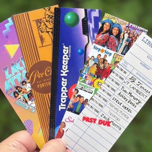 May include: A collection of five rectangular bookmarks featuring 1990s pop culture designs. The bookmarks display graphics including a Zach Attack Summer '93 print, a Pee-Chee portfolio design, a Trapper Keeper notebook, 90s sitcom cast photos, and a library card with the text "PAST DUE" and various names like DJ Tanner, Tia Mowry, and Zack Morris written in black ink.