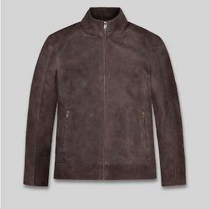 May include: A brown leather jacket with a zip-up front and two side pockets. The jacket has a stand-up collar and a tailored fit. The jacket is made of a soft, supple leather and is a versatile outerwear piece.