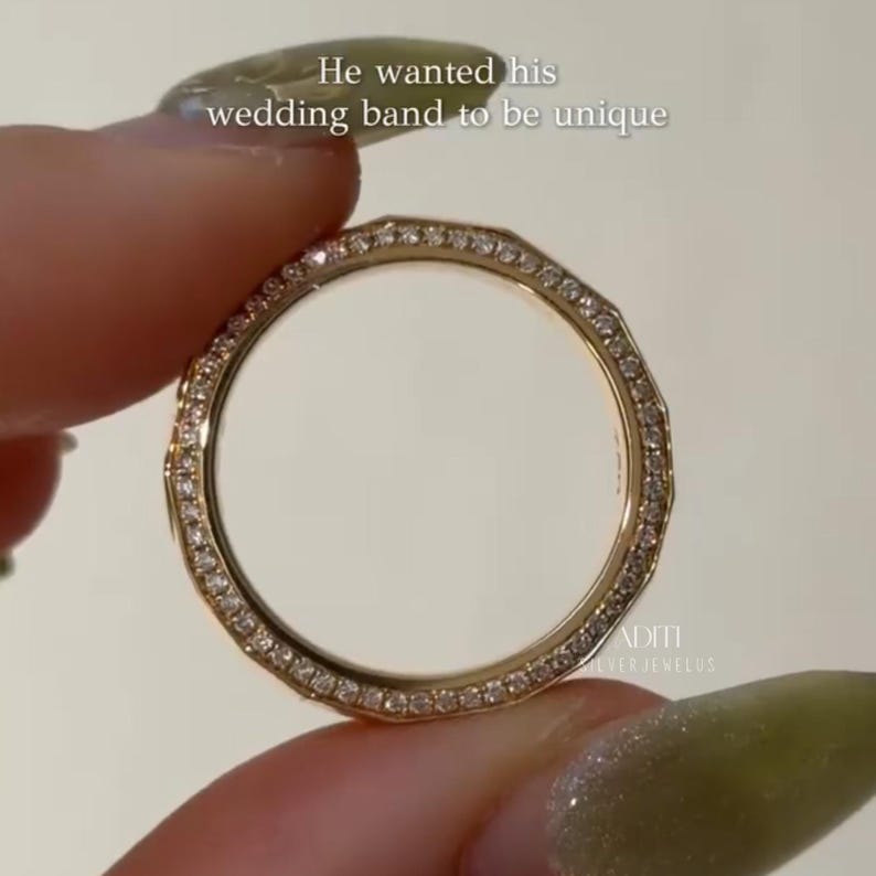 May include: Modern faceted men's wedding band crafted in solid 14K yellow gold featuring a geometric exterior and pavé-set lab diamonds along one side of the band. The text "BY ADITISILVERJEWELUS" is visible at the bottom.