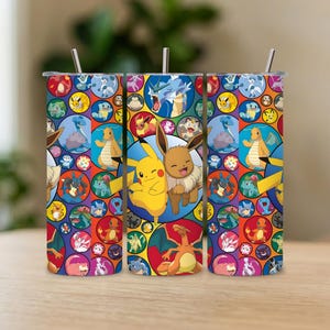 May include: Three stainless steel tumblers with colourful designs featuring various Pokémon characters. Each tumbler has a silver straw and a lid. The designs include Pikachu, Eevee, and other popular characters in a stained-glass style.