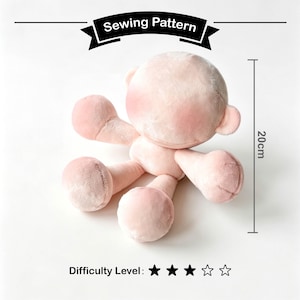 May include: A plush, light pink doll with a round head, two small ears, and four outstretched limbs. The doll measures 20cm in height. The text "Sewing Pattern" is displayed on a black banner above the doll. The difficulty level is indicated by three black stars out of five.