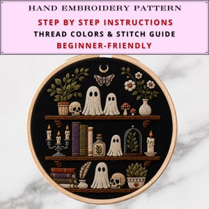 May include: A hand embroidery pattern in a wooden hoop featuring three shelves on black fabric. The design includes ghosts, skulls, books, candles, plants, and a moth. Text reads: HAND EMBROIDERY PATTERN, STEP BY STEP INSTRUCTIONS, THREAD COLORS & STITCH GUIDE, BEGINNER-FRIENDLY.