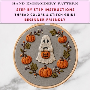 May include: A hand embroidery pattern featuring a white ghost holding an orange jack-o'-lantern, surrounded by a wreath of orange pumpkins and green leaves on grey fabric. Text reads: HAND EMBROIDERY PATTERN, STEP BY STEP INSTRUCTIONS, THREAD COLORS & STITCH GUIDE, BEGINNER-FRIENDLY.