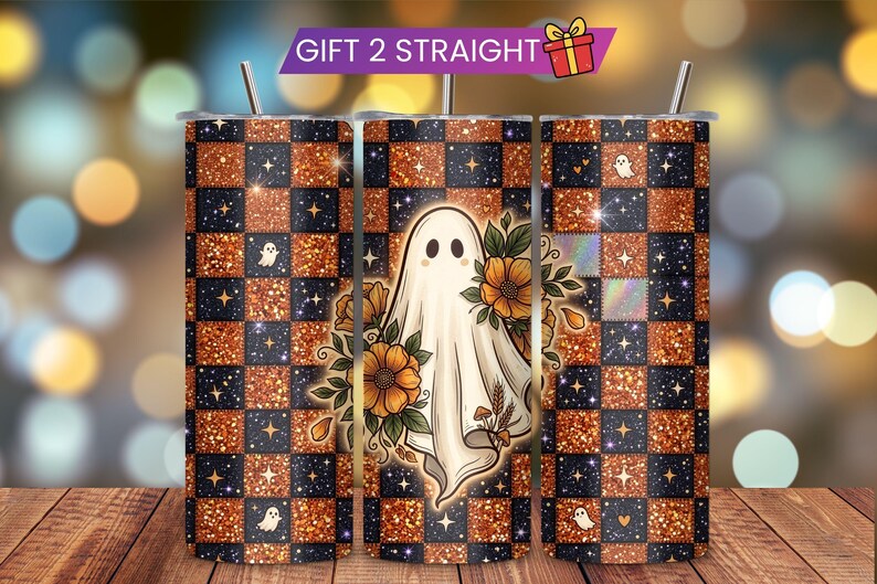 May include: A cylindrical tumbler featuring a checkered pattern of glittery orange and dark blue squares with small stars and ghost icons. The center displays a white ghost surrounded by orange flowers and green leaves. A metal straw is inserted at the top.