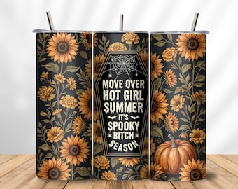 May include: A cylindrical tumbler with a lid and straw, featuring a black background with a pattern of yellow sunflowers, green leaves, and an orange pumpkin. The center displays a coffin-shaped graphic with a spiderweb and the text MOVE OVER HOT GIRL SUMMER IT'S SPOOKY BITCH SEASON.