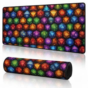 May include: A rectangular desk mat featuring a repeating pattern of multi-colored polyhedral dice in shades of blue, green, orange, purple, and red. Each die displays a distinct number. The mat is shown both laid flat and rolled up.