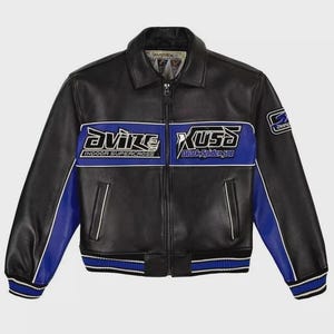 May include: A black leather jacket featuring blue panels on the sleeves and a horizontal blue stripe across the chest. The chest displays the text Avirex Indoor Supercross and Xusa Black Spider 500. It has a front zip, collar, and striped cuffs.