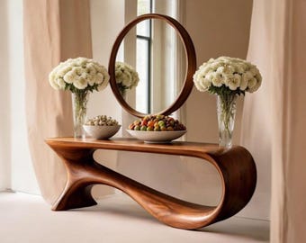 Consola escultural de madera maciza con espejo, decoración moderna y orgánica para recibidor.