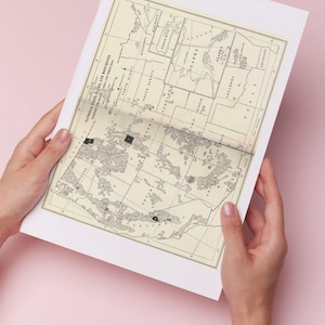 May include: A rectangular paper print featuring a vintage-style map titled National Parks and Monuments, showing various United States regions with black shaded areas, thin black borders, and text labels printed in a clear, dark font on a cream background.