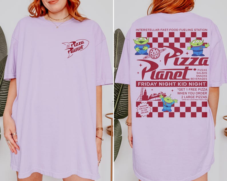 May include: A light purple t-shirt featuring the "Pizza Planet" logo on the front and a graphic on the back with the text "Interstellar Fast-Food Fueling Station." The back graphic includes the text "Friday Night Kid Night" and images of green aliens.