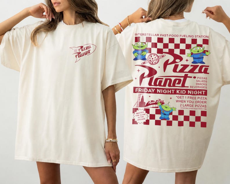 May include: Cream-colored t-shirt with the Pizza Planet logo on the front and back. The back features the text "Interstellar Fast-Food Fueling Station" and "Friday Night Kid Night" with alien characters and pizza graphics.