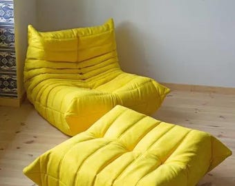 Ligne Roset Togo Lounge Chair en poef gele microvezel