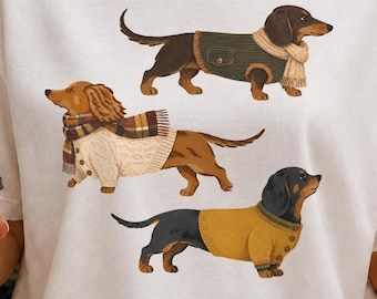 Bassotto autunnale PNG / Clipart di cane salsiccia / Grafica accogliente per animali domestici autunnali / Design per maglietta da mamma di cane