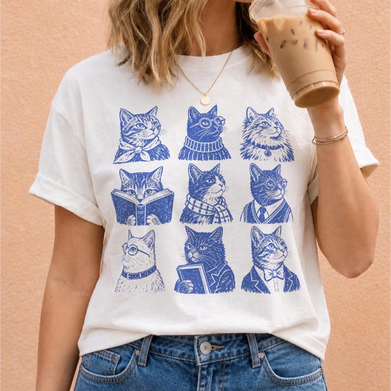 PNG design featuring nine blue vintage-style cats wearing glasses, scarves, bow ties, and scholarly outfits, with several reading or holding books.